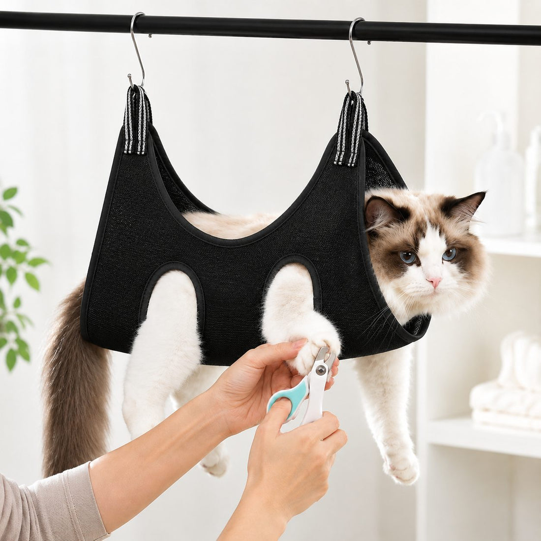 Black pet grooming sling bag for cats and small dogs during supervised grooming