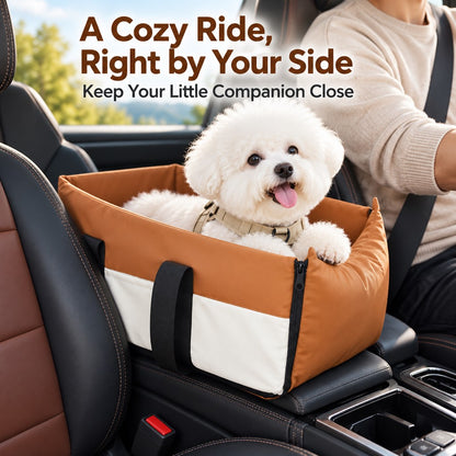 Small dog in an orange center console travel bed beside the driver
