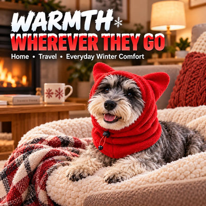 Dog wearing a red fleece winter hood indoors